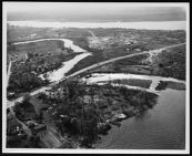 Aerial  shot of inlet/river meandering, & road